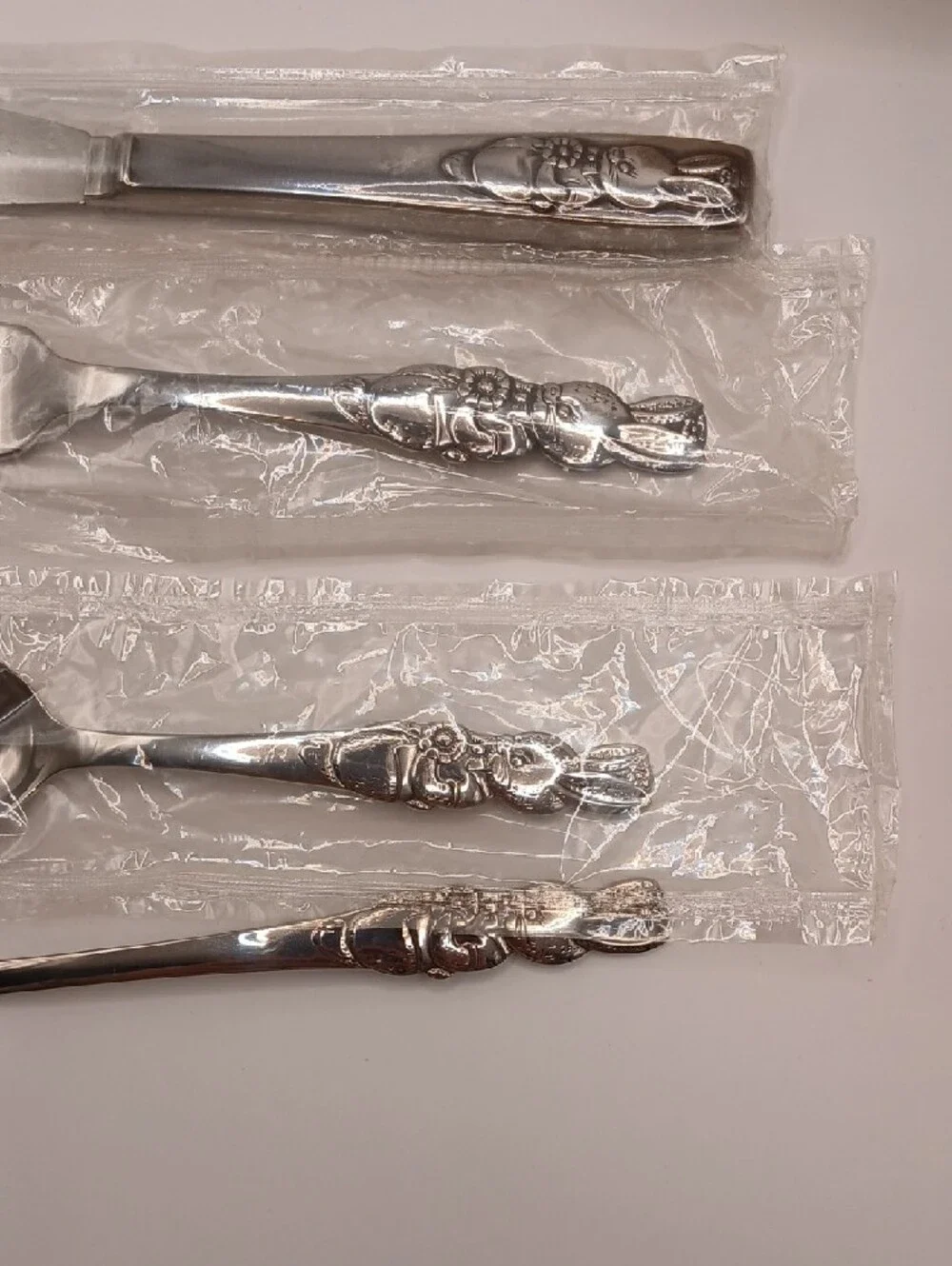 Oneida Peter Rabbit Child's Vtg Stainless Flatware Set of 4 (3 new, 1 used)